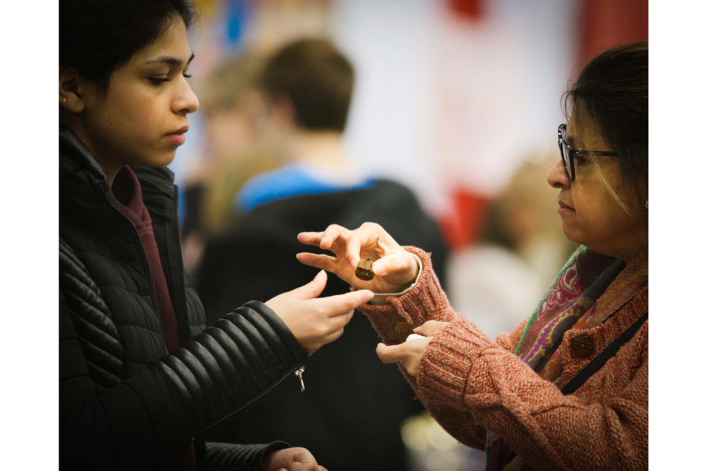 Women sharing chocolate samples at ChocoFest