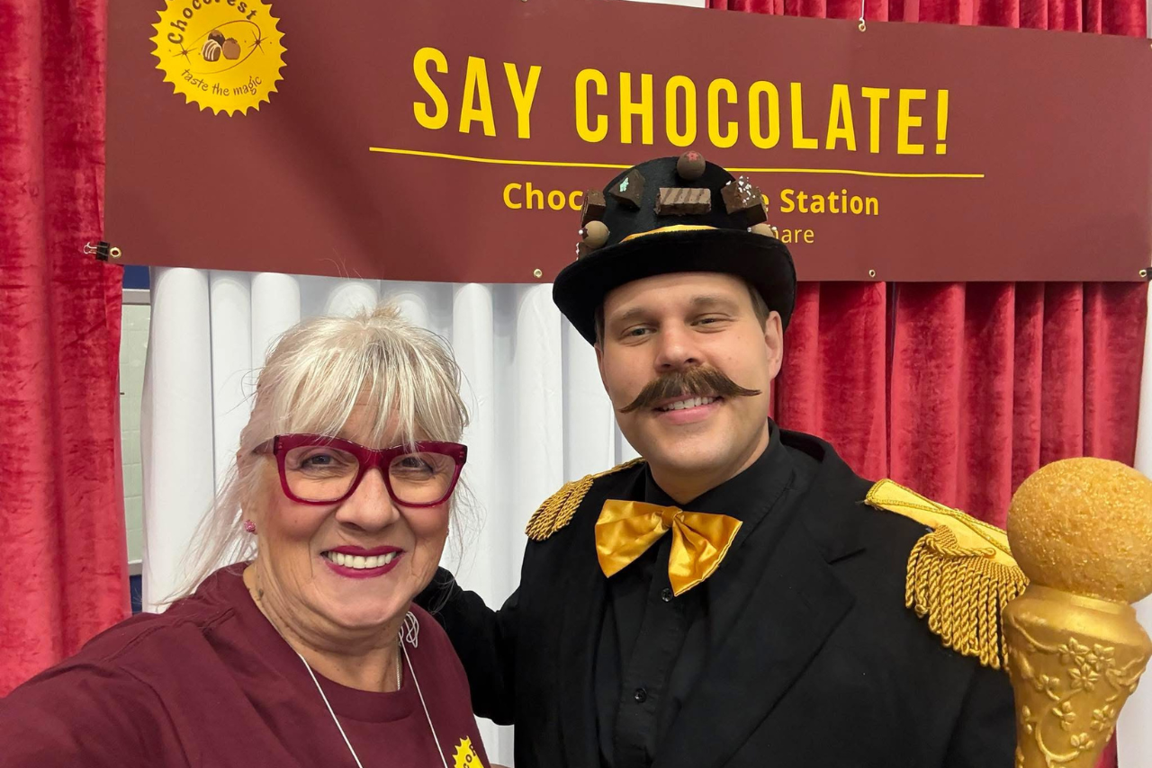 Smiling volunteer with Sir Chocolot